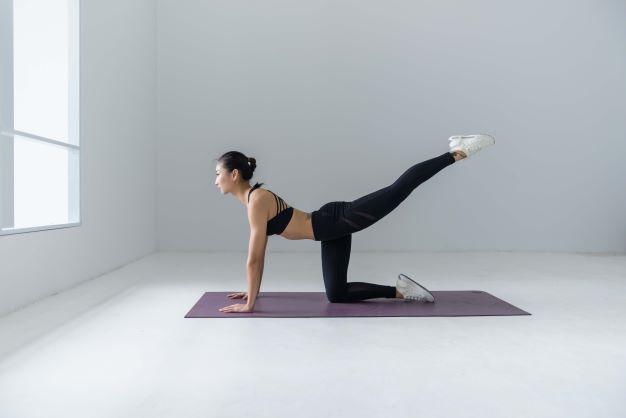 Static flexibility: A women doing Pilates.