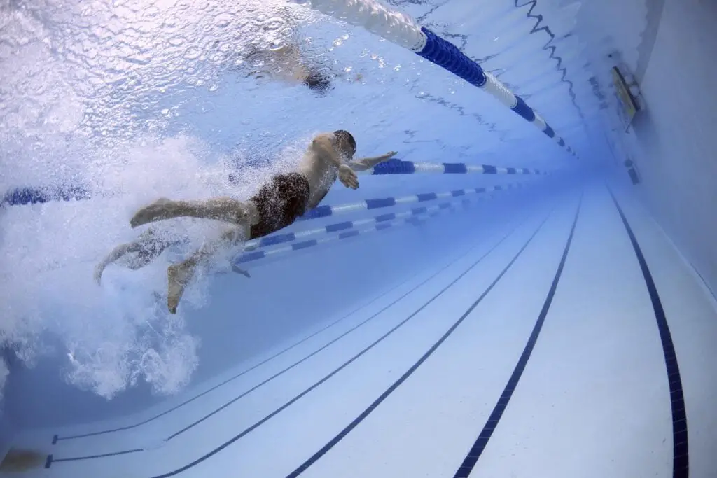 Dynamic flexibility: A men Swimming in the pool.