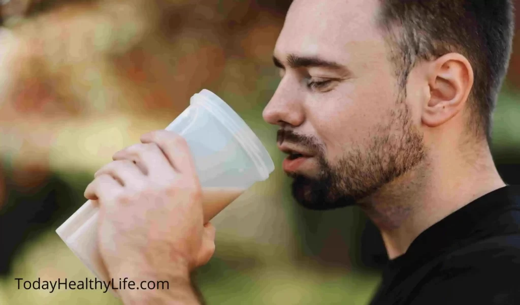 A man drinking the best Nitric Oxide supplements before a workout. 