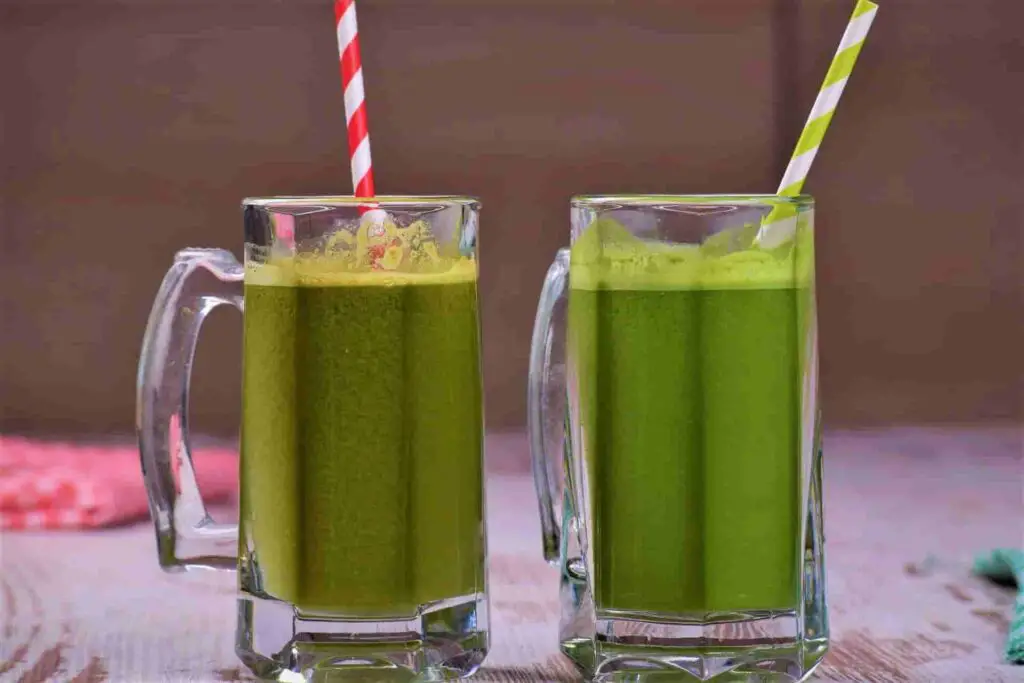 2 glass of green juice on the table for 14 day liquid diet weight loss results.