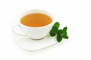 A cup of best Garcinia Cambogia green tea with white background.