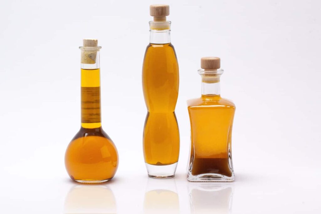 3 bottle of mustard oil with white background.